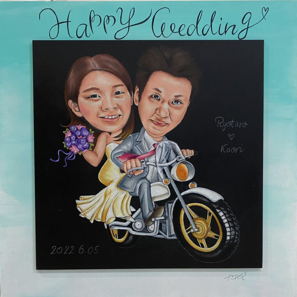 バイクに乗る男女の絵